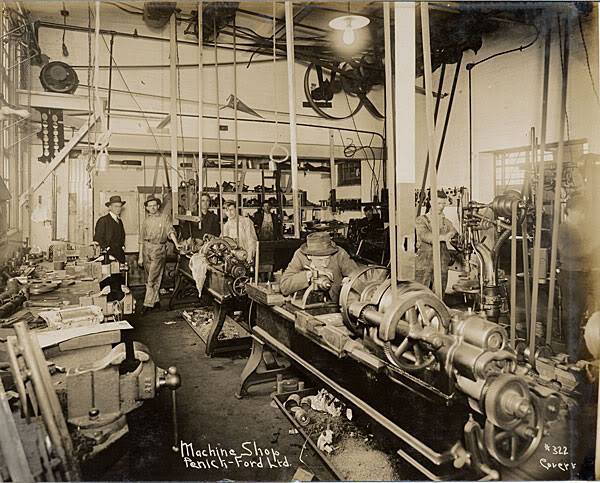 Steam-era factory interior, line shafts and belts